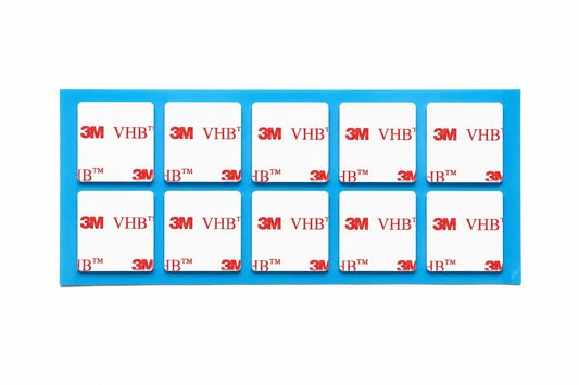 Genuine 3M VHB 4910 clear square double sided sticky pads supplied as a 10 pad sheet with white 3M VHB printed liner. Crystal clear acrylic foam adhesive for home, office, commercial and industrial mounting.