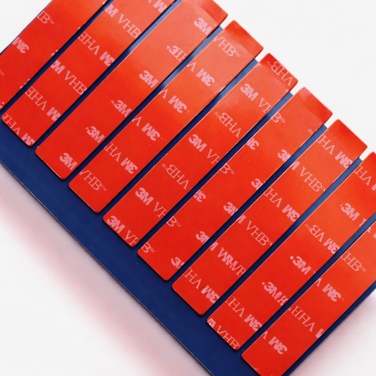Pack of ten genuine 3M VHB 90mm x 15mm number plate tape pads on the original blue backing sheet.